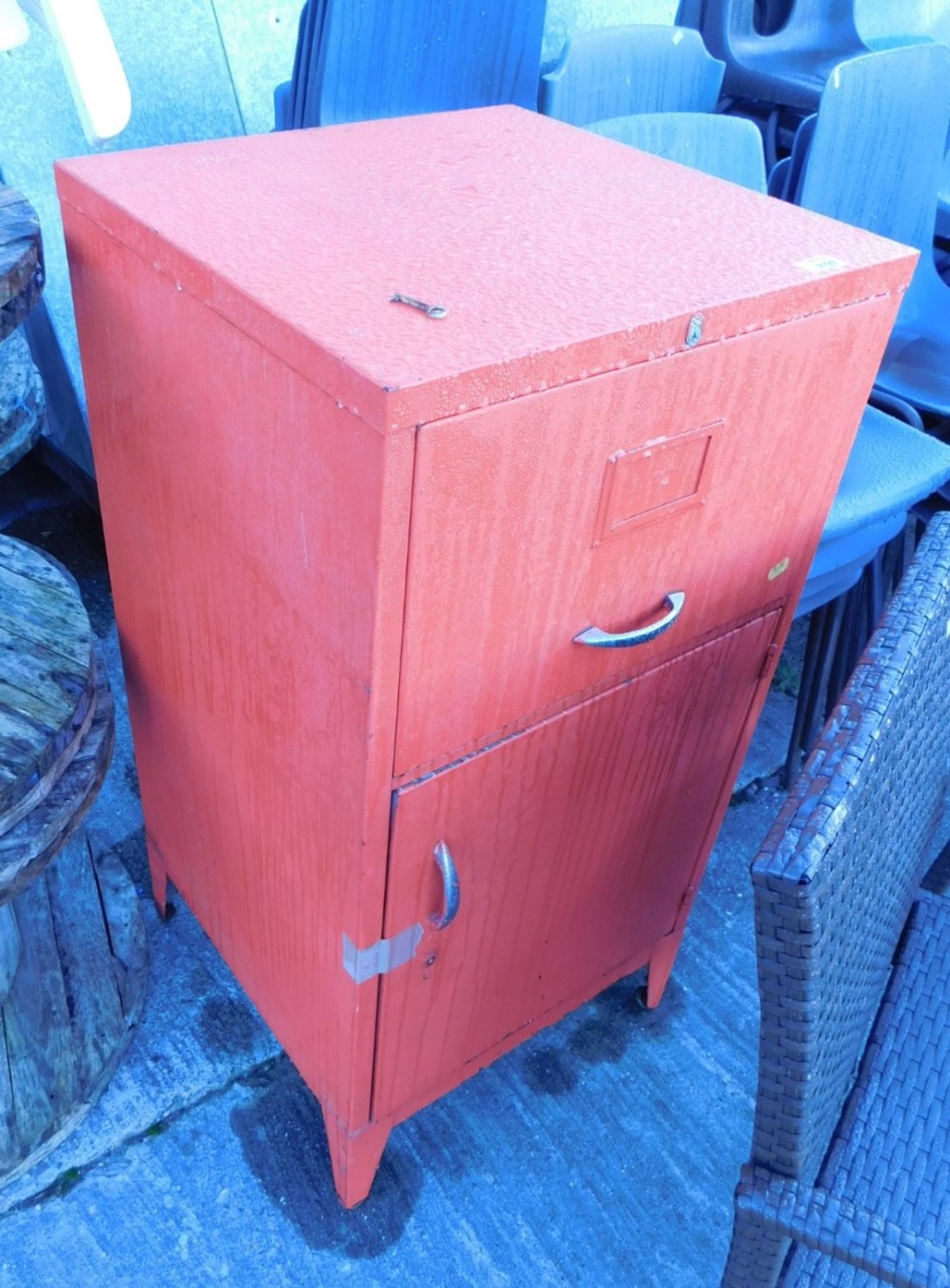 A two door metal tool cabinet.