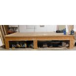 A timber and match board work bench, 445cm x 490cm. VAT is also payable on the hammer price of this