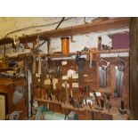 Various woodworking tools, including spoke shaves, tenon saws, mallets, etc.