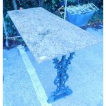 A Victorian cast iron table base, with later marble finish top.