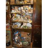 A tool cupboard, containing numerous metal fittings, hinges, screws, equipment etc.