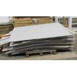 A pallet of plasterboard sheets. VAT is also payable on the hammer price of this lot.