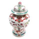 A Chinese porcelain famille rose jar and cover, of baluster form, decorated with flowers, vase, tabl