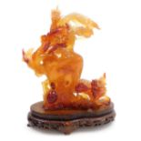 A Chinese agate carving of a vase, enveloped with two dragons and a flaming pearl, terrapin, and a h