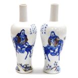 A pair of 19thC Chinese porcelain vases, of mallet form, decorated in underglaze blue and red with a