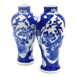 A pair of 19thC Chinese porcelain blue and white vases, of baluster form with a raised neck, each de