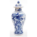 A 19thC Chinese porcelain blue and white vase and cover, of baluster form, decorated with a phoenix