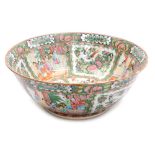 An early 20thC Chinese porcelain famille rose bowl, decorated with reserves of figures in interior s