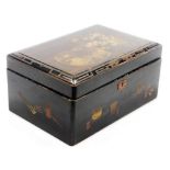 A 20thC Japanese lacquer box, decorated with birds to top and household objects to edges, 25.5cm wid