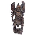 A Balinese hardwood and silver wire inlaid figure, of a Garunda, modelled standing with wings aloft