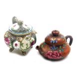 Two miniature teapots, comprising a Chinese Yixing example, decorated in enamels with flowers and bu