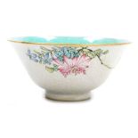 A Chinese Qing dynasty porcelain bowl, with a turquoise glaze interior, the exterior decorated in en