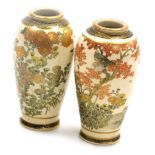 A pair of Japanese Satsuma miniature vases, of cylindrical tapering form, decorated with flowers and
