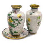 Three items of Chinese cloisonne, comprising a pair of vases and a plate, each decorated with flower
