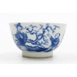 An 18thC Chinese blue and white porcelain tea bowl, decorated with an island landscape, and figures