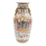 A 19thC Chinese porcelain famille rose vase, of baluster form, with gilt applied dog of fo handles,