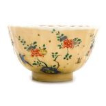 A 19thC Chinese cafe au lait bowl, of fluted form, decorated internally and externally with flowers,