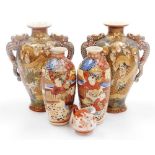 A pair of early 20thC Japanese Satsuma vases, each of baluster form with applied dragon handles, dec