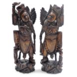 A pair of Balinese hardwood and silver wirework figures of the goddess Zhang Xian, each modelled wit