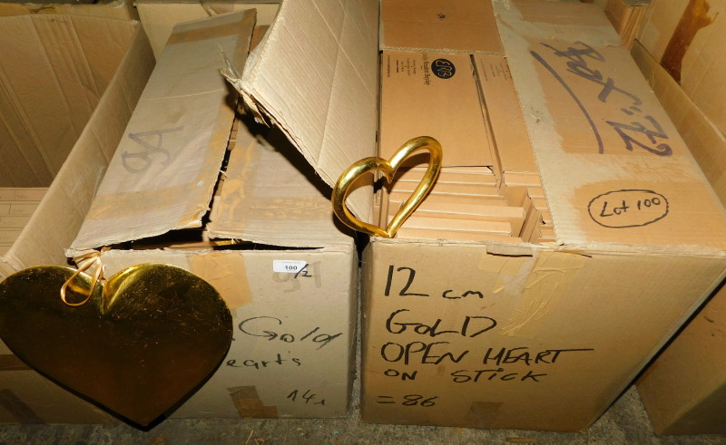 A group of gold painted wooden heart decorations, 30cm high, and a quantity of gold coloured open he