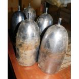 Five hammered metal light shades, of cylindrical elongated form, with copper coloured interior, 29cm