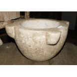 A carved stone mortar, 20cm high. Note: VAT is payable on the hammer price of this lot at 20%.