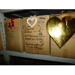 A group of painted wooden decorations, to include gold coloured hearts, 29cm high, red open stars, 1