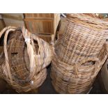 A quantity of wicker baskets, to include log basket of cylindrical form with four ring handles, 74cm
