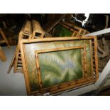 A quantity of bamboo framed trays, etc., each with central hand painted leaf decoration, etc. Note: