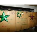 A group of green wooden star hanging decorations, to include purple glitter and open stars., each 20