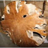 A teak root coffee table, 53cm high, the top 120cm diameter. Note: VAT is payable on the hammer pri