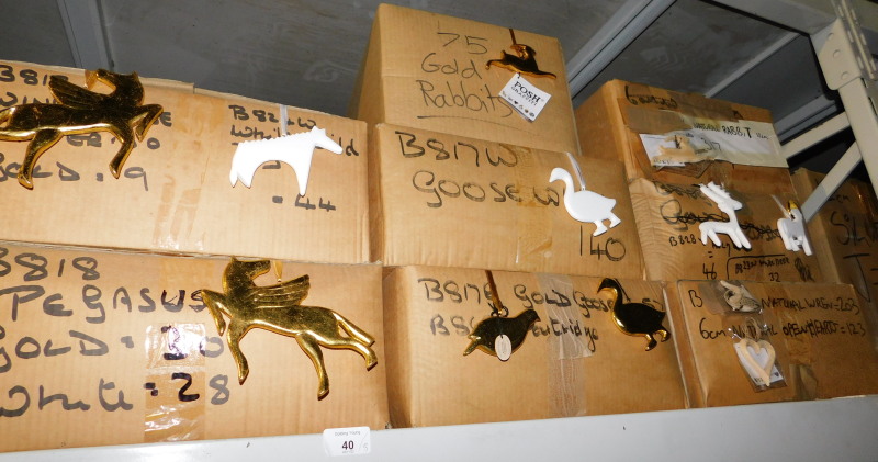 A quantity of painted carved wooden hanging decorations, to include white geese, gold coloured rabbi
