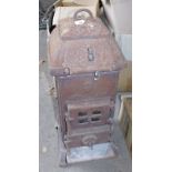 A cast iron stove, 76cm high. Note: VAT is payable on the hammer price of this lot at 20%.