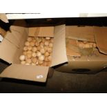 Two boxes of carved wooden apples. Note: VAT is payable on the hammer price of this lot at 20%.