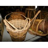 A group of wicker items, to include a two handled log basket, 40cm high, flower basket, 43cm high, b