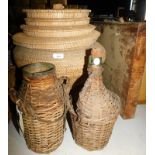 A woven storage basket, with lid, 42cm high, various loose lids, two wicker storage containers with