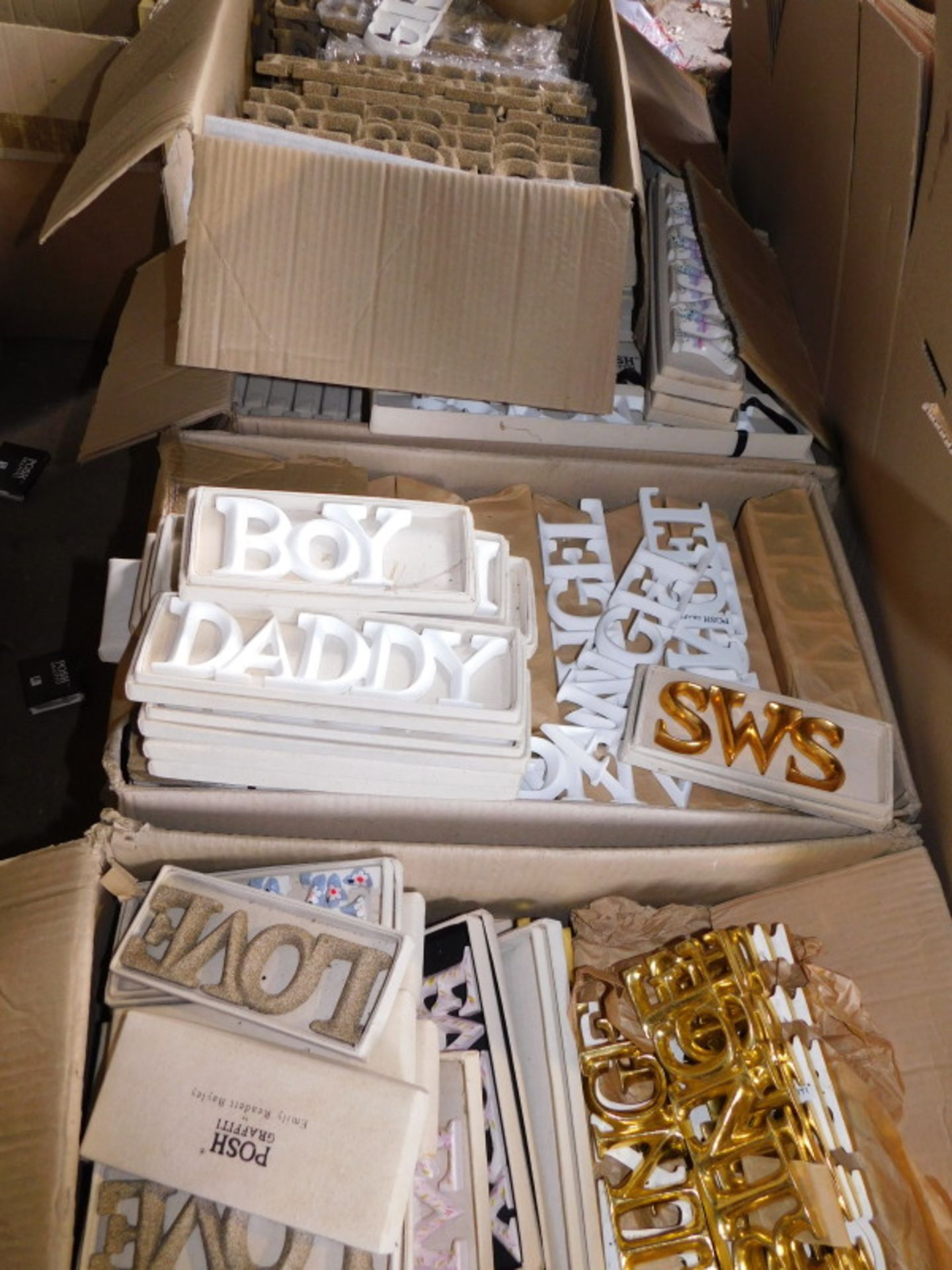 A group of painted carved wooden words, to include Boy, Daddy, Angel, Prince, Girl, etc., in gold, w