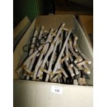 Two boxes of wooden child's coat hangers, each 40cm wide. Note: VAT is payable on the hammer price