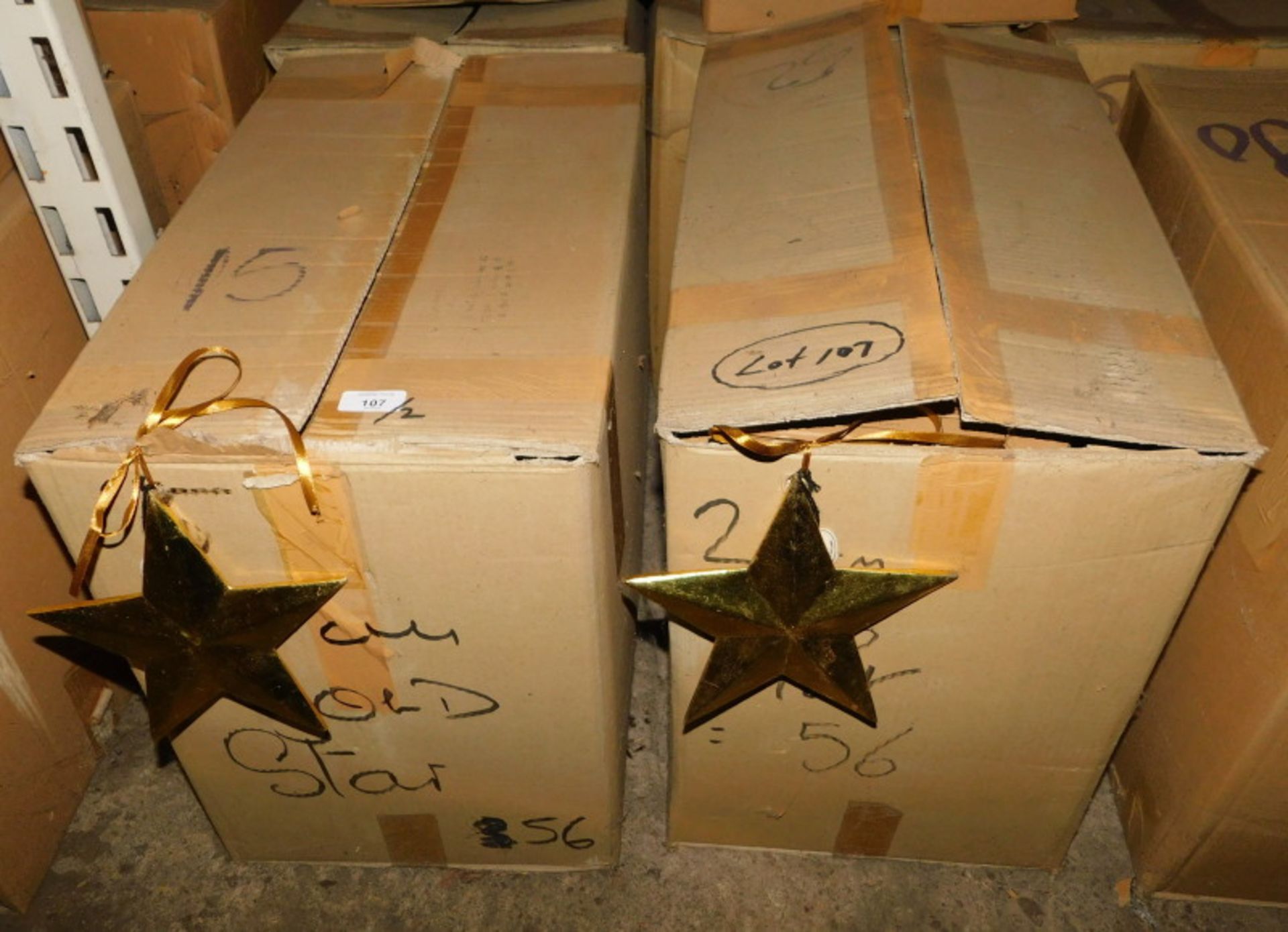 A group of gold coloured wooden star decorations, each 20cm high. (2 boxes) Note: VAT is payable on