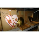 A group of painted heart shaped wooden hanging decorations, to include gold coloured, floral painted