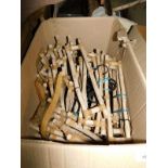 Two boxes of wooden child's coat hangers, each 40cm wide. Note: VAT is payable on the hammer price