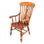 A Victorian elm and stained oak kitchen chair, with a curved crest ware rail, and carved splat, soli