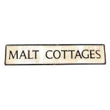 A 20thC metal 'Malt Cottages' sign, 109cm x 22.5cm.