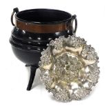 A cast iron and copper bound cauldron, with ring handles, 31cm high, together with a silver plated d