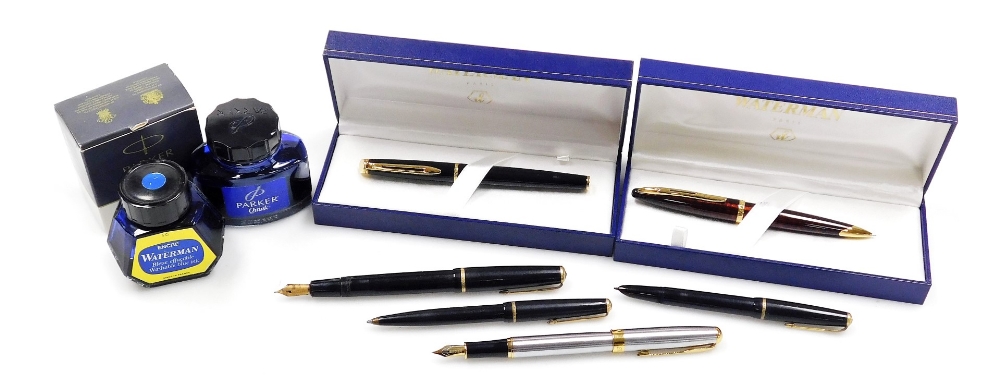 A group of fountain and other pens, to include a Waterman fountain pen in black casing with a gold c