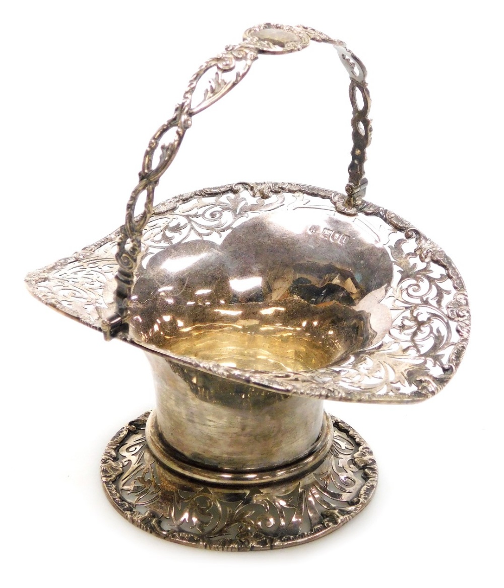 An Edward VII silver basket, of waisted and flared form, with pierced and embossed foliate and rococ