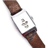 A mid century gentleman's Jump Hour stainless steel cased wristwatch, with three apertures, each for