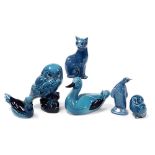 A group of six Poole blue glazed pottery figures of birds, including a penguin and two owls, togethe