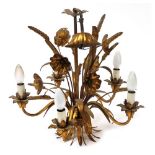 An early 20thC gilt metal five branch chandelier, decorated with flowers, leaves and corn, 64cm high