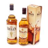 A Bells 1L bottle of Original Scotch whisky, together with a 70cl bottle of aged eight years whisky,